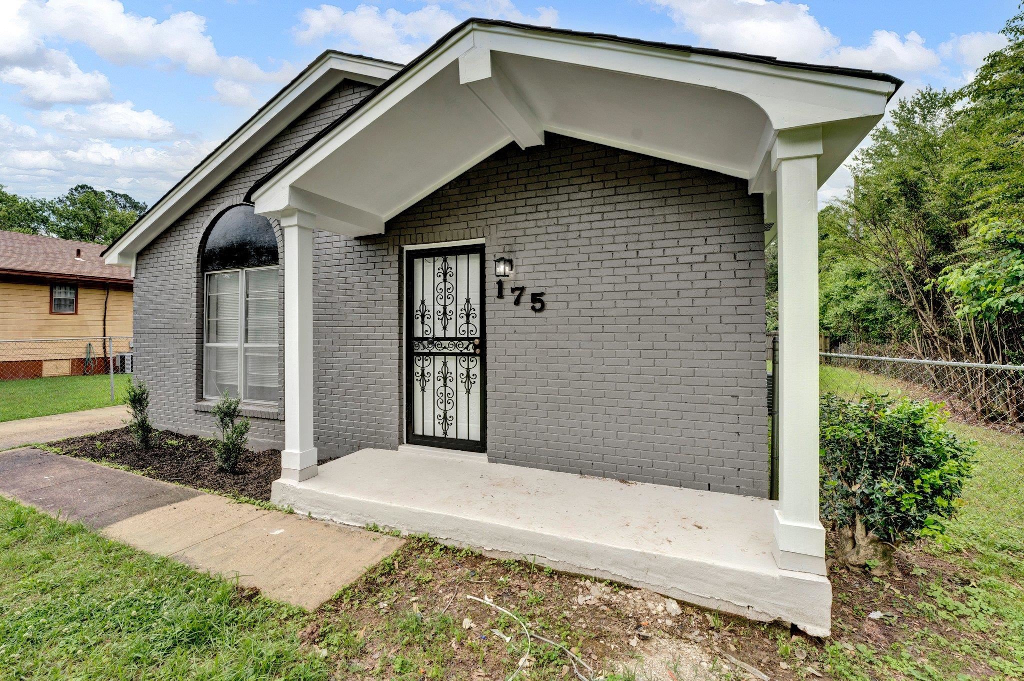 175 Stoneham Road Memphis, TN 38109 - Photo 1 of 25 a front view of a house with a yard