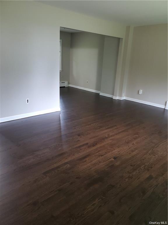 349 South Middletown Road Nanuet, NY 10954 - Photo 6 of 9 an empty room with wooden floor and windows
