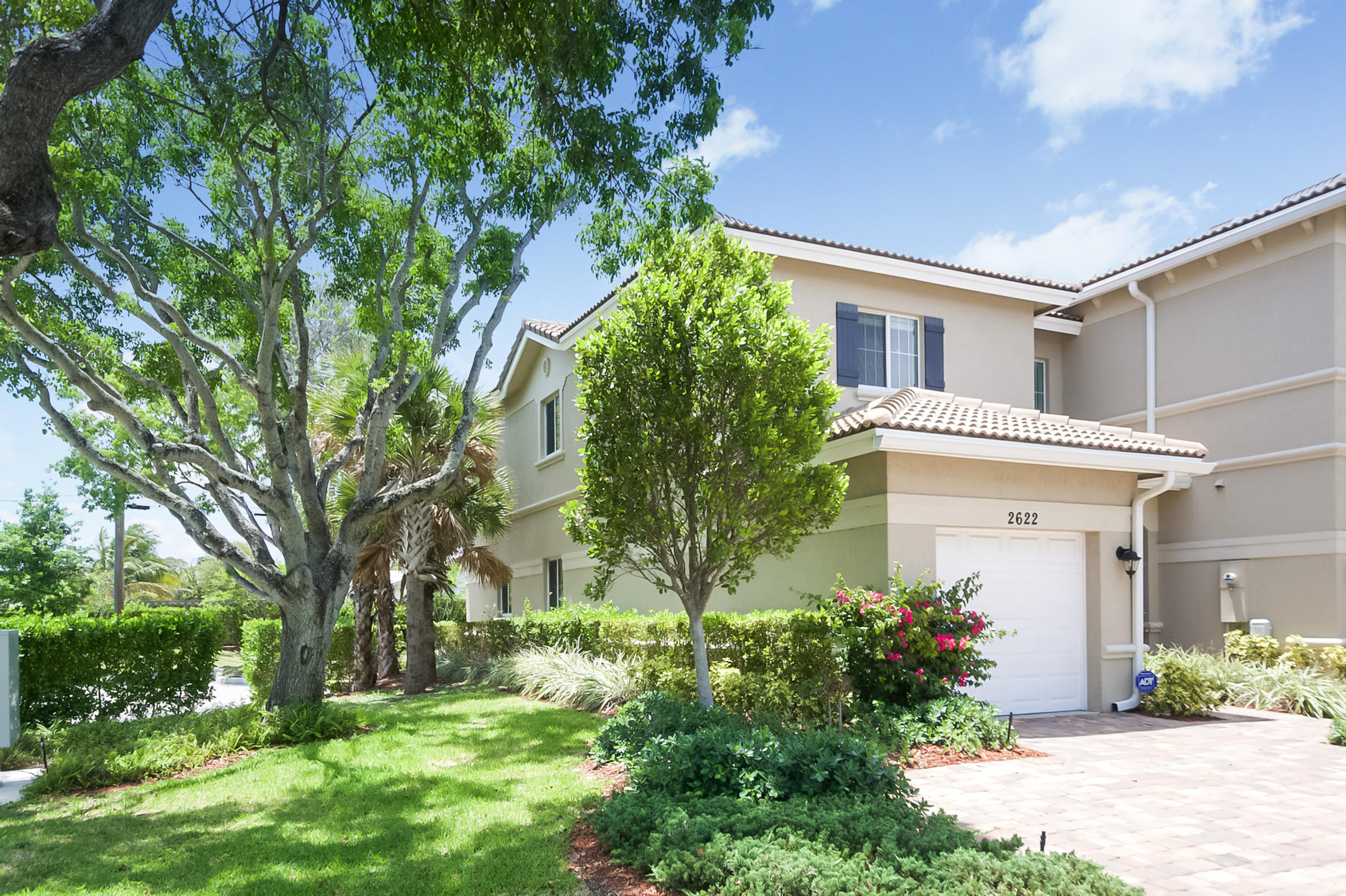 2622 Webb Avenue Delray Beach, FL 33444 - Photo 2 of 16 a front view of a house with garden