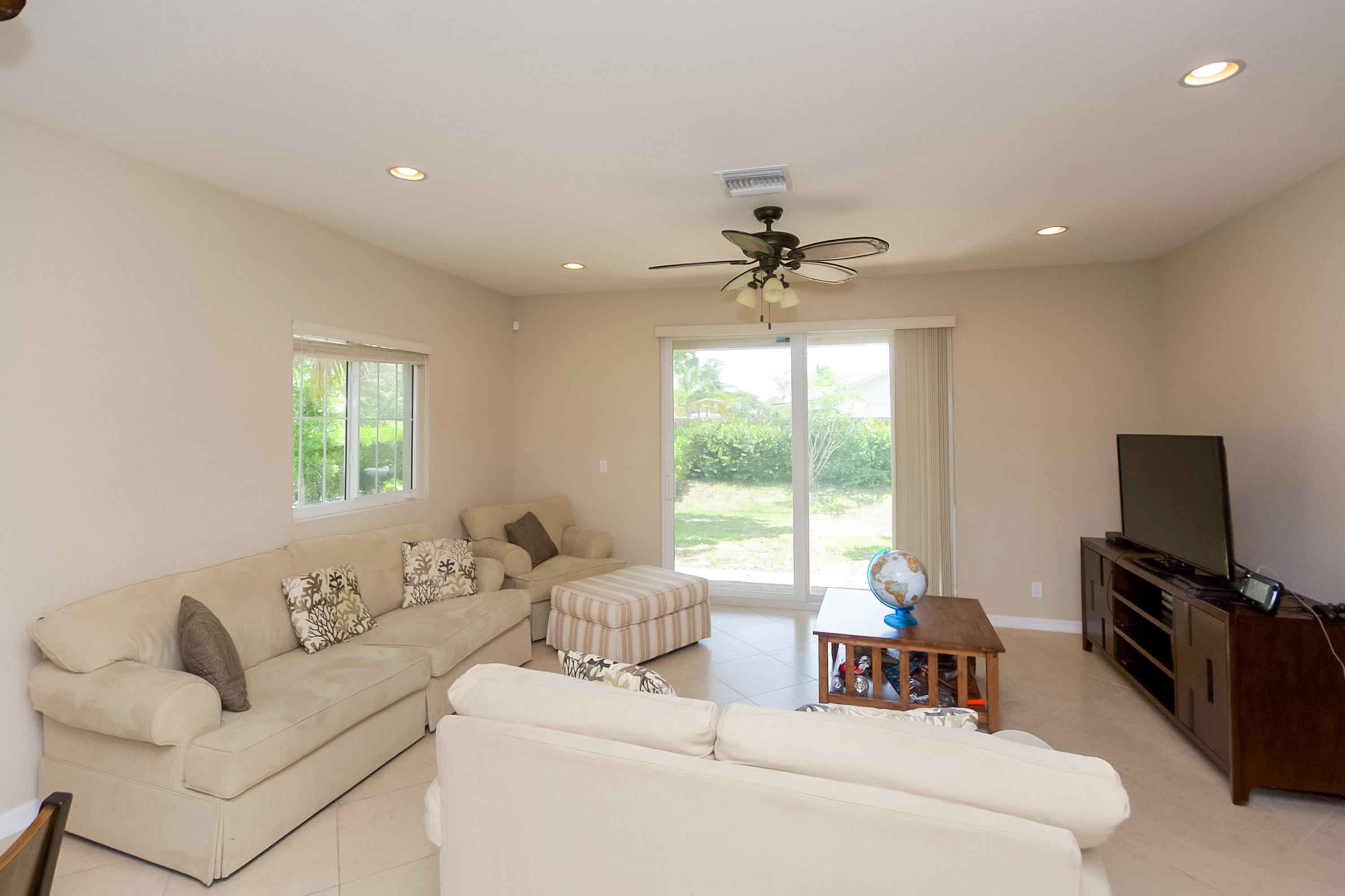 2622 Webb Avenue Delray Beach, FL 33444 - Photo 3 of 16 a living room with furniture and a flat screen tv