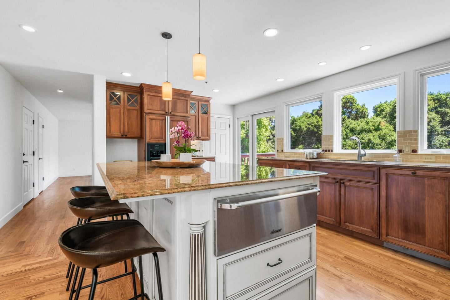 144 Victoria Lane Aptos, CA 95003 - Photo 11 of 36 a kitchen with stainless steel appliances granite countertop a stove and a sink