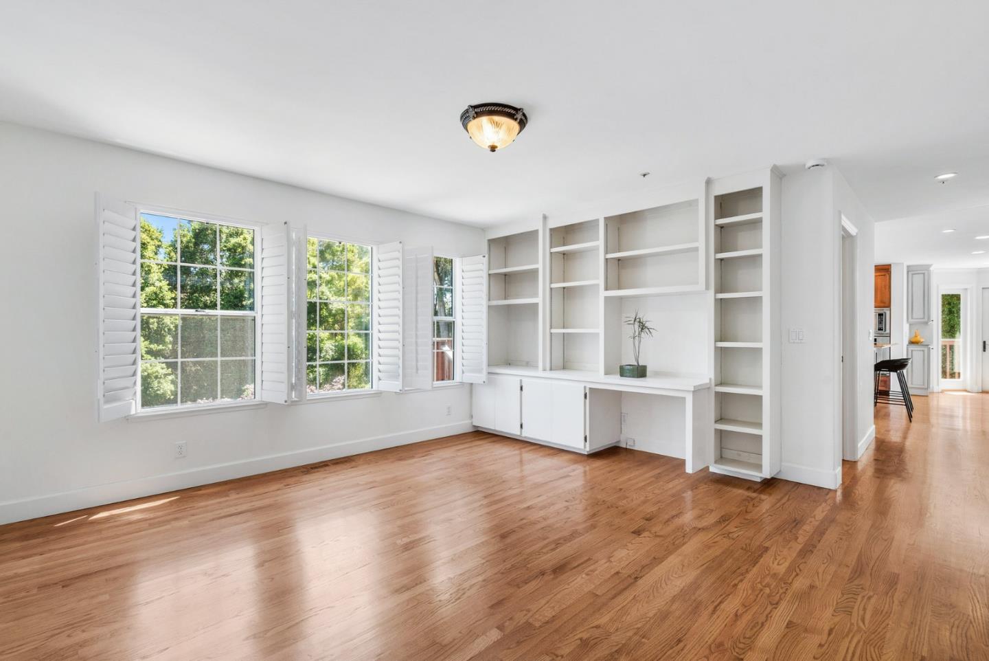 144 Victoria Lane Aptos, CA 95003 - Photo 15 of 36 a view of an empty room with a window and wooden floor