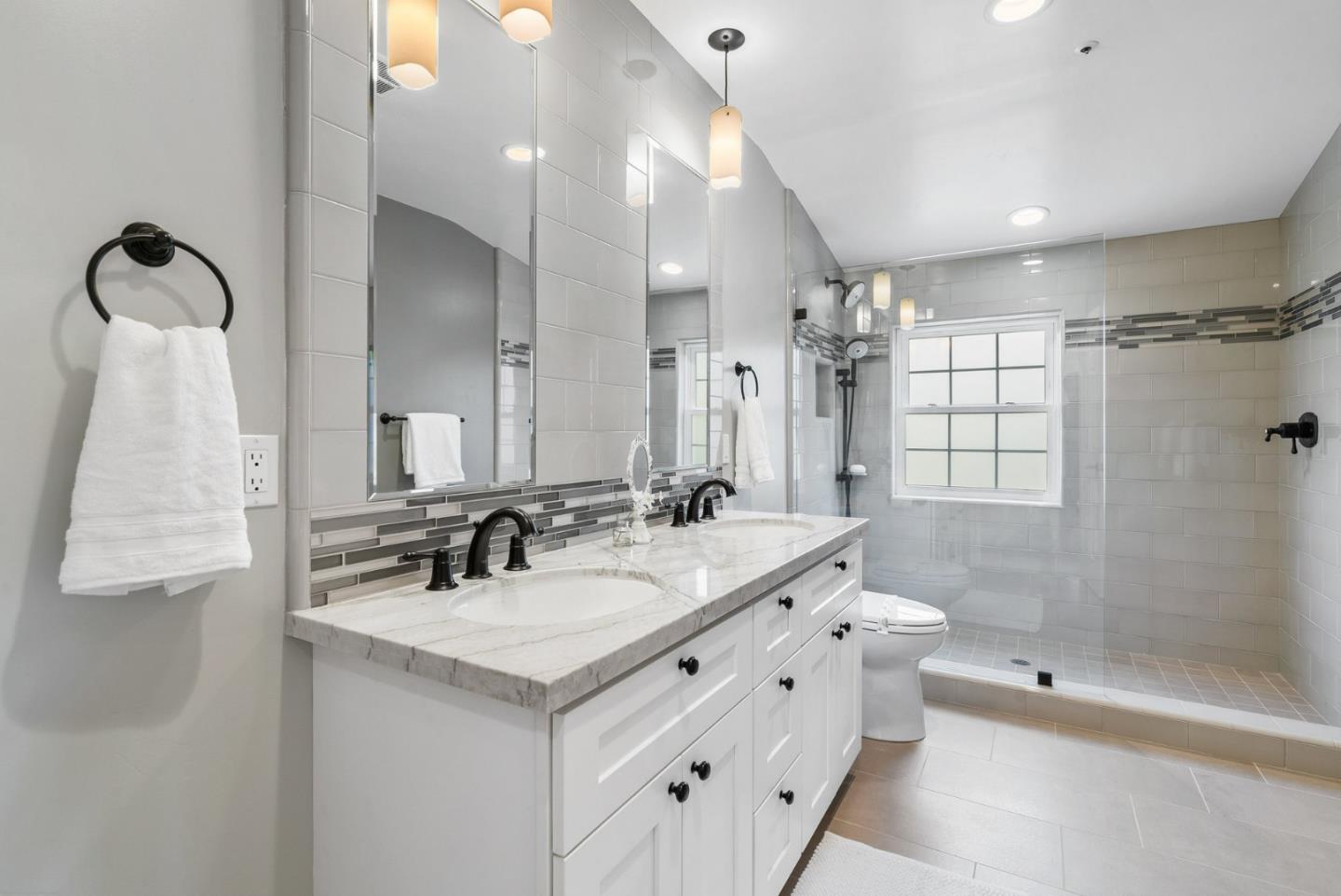144 Victoria Lane Aptos, CA 95003 - Photo 17 of 36 a bathroom with a double vanity sink mirror and shower