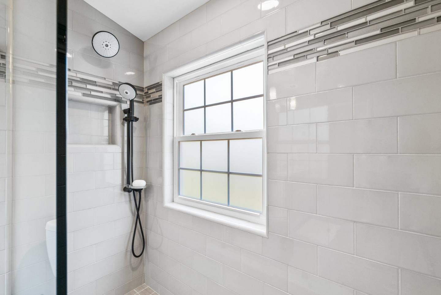 144 Victoria Lane Aptos, CA 95003 - Photo 19 of 36 a bathroom with a shower and a window