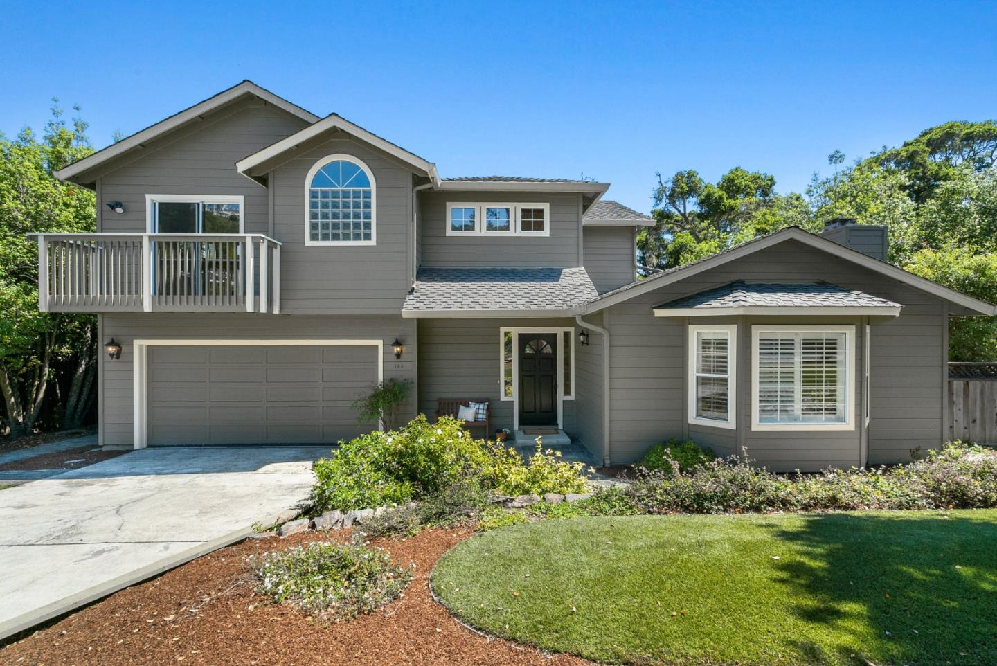 144 Victoria Lane Aptos, CA 95003 - Photo 3 of 36 a front view of a house with a garden