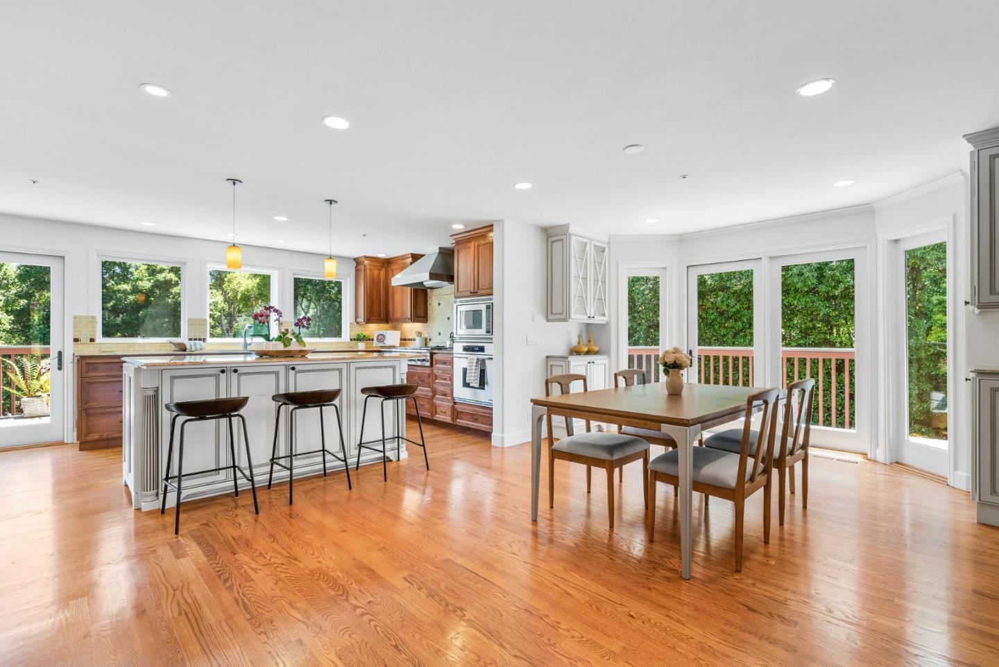 144 Victoria Lane Aptos, CA 95003 - Photo 8 of 36 a dining room with furniture wooden floor and a floor to ceiling window