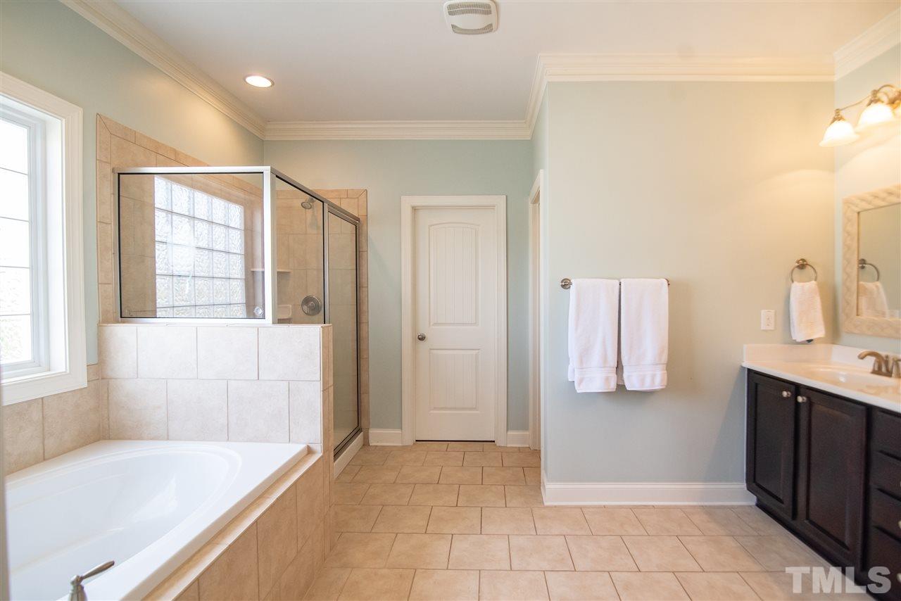 2720 Country Charm Road Raleigh, NC 27614 - Photo 15 of 30 The spa like master bathroom is the perfect place to unwind.