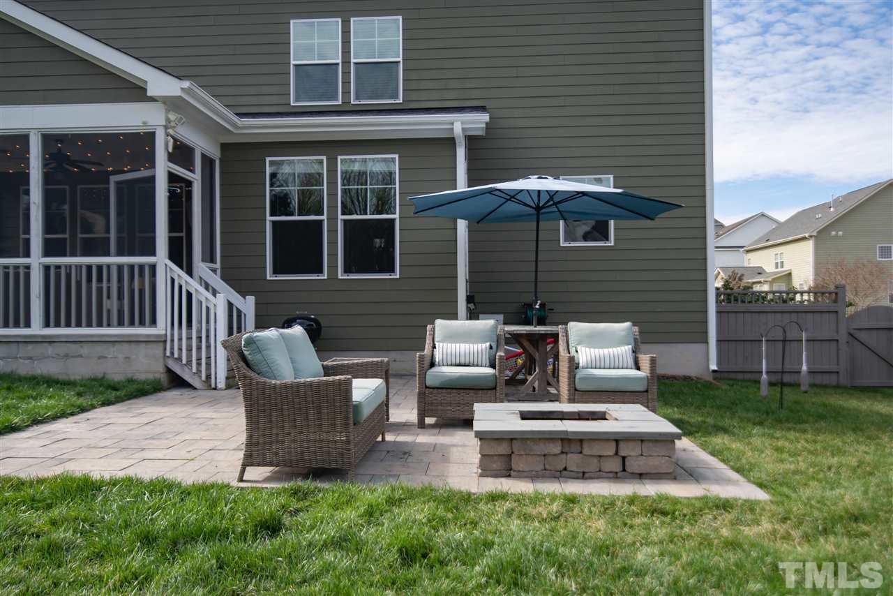 2720 Country Charm Road Raleigh, NC 27614 - Photo 23 of 30 Raise the bar on outdoor living with the fenced yard featuring awesome patio and fire pit!
