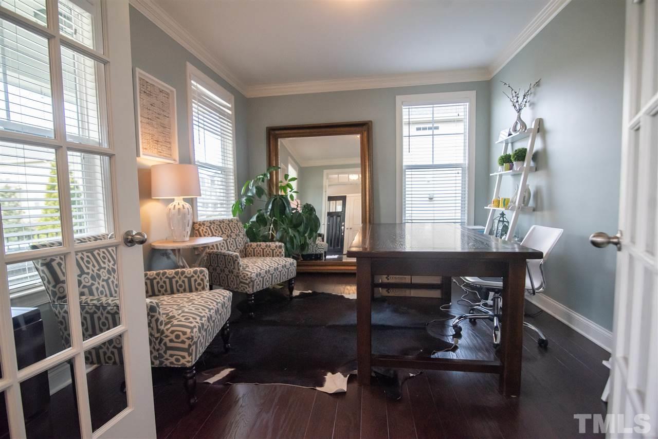 2720 Country Charm Road Raleigh, NC 27614 - Photo 4 of 30 You'll love working from home in this sophisticated study with french door entry.