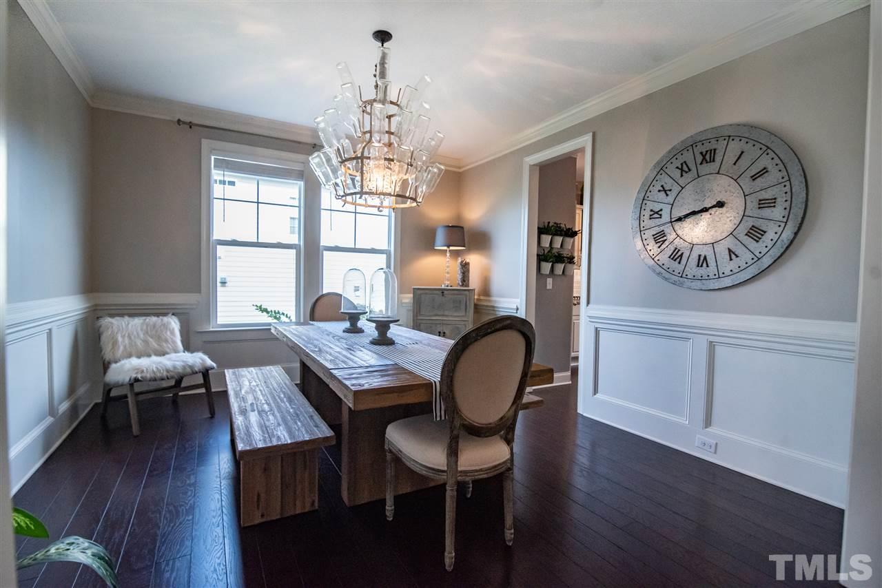 2720 Country Charm Road Raleigh, NC 27614 - Photo 5 of 30 This timelessly fresh dining room features striking woodwork and unique chandelier.