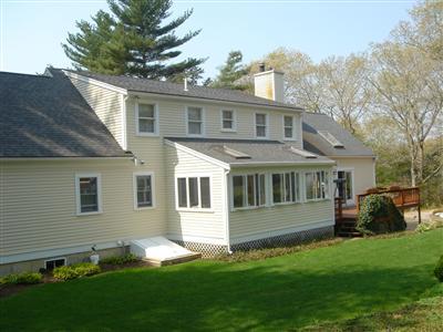Undisclosed Address Marstons Mills, MA 02648 - Photo 2 of 10 a front view of house with yard and green space