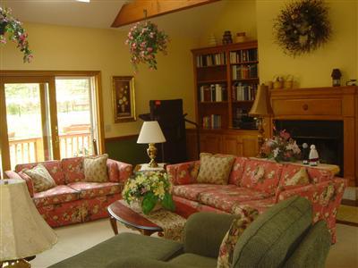 Undisclosed Address Marstons Mills, MA 02648 - Photo 3 of 10 a living room with furniture and a fireplace