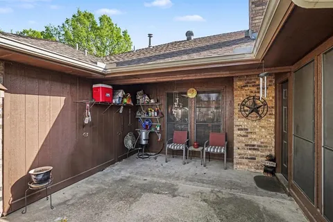 a view of a backyard with sitting area