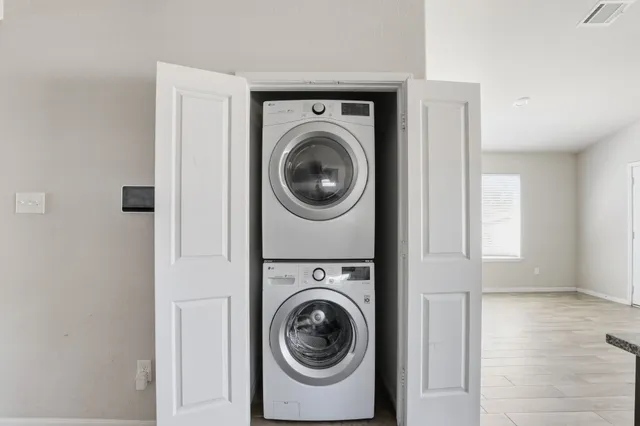 a utility room with dryer and washer