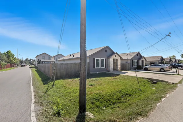 a view of a house with pool and a chairs