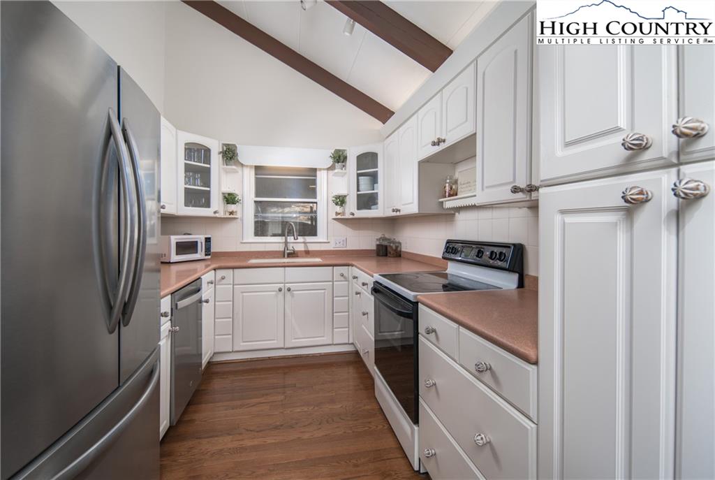 485 Chestnut Drive Boone, NC 28607 - Photo 12 of 48 a kitchen with stainless steel appliances granite countertop a stove a sink and a refrigerator