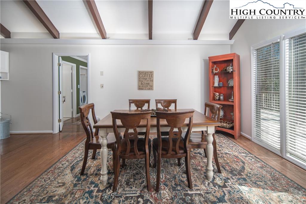 485 Chestnut Drive Boone, NC 28607 - Photo 13 of 48 a view of a dining room with furniture and wooden floor