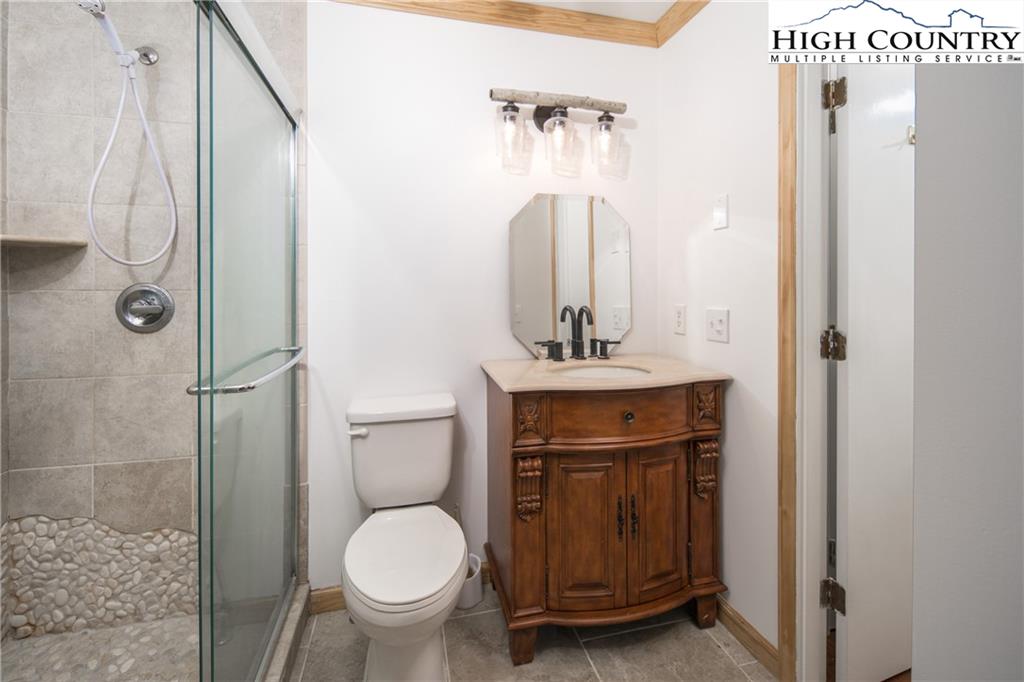 485 Chestnut Drive Boone, NC 28607 - Photo 20 of 48 a bathroom with a toilet sink and shower