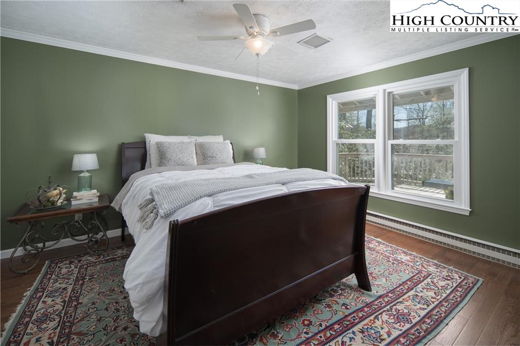 485 Chestnut Drive Boone, NC 28607 - Photo 22 of 48 a bed sitting in a bedroom next to a window