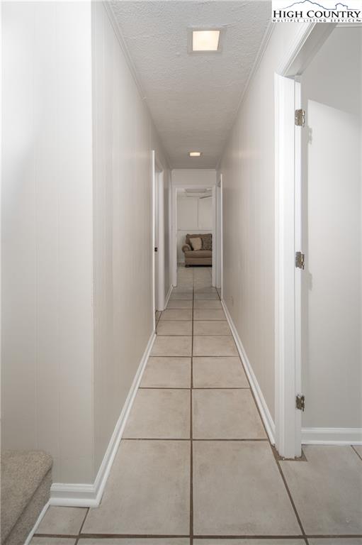 485 Chestnut Drive Boone, NC 28607 - Photo 26 of 48 a hallway with white checkered floor