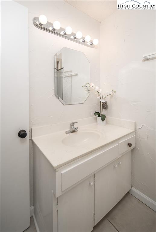485 Chestnut Drive Boone, NC 28607 - Photo 32 of 48 a bathroom with a sink and a mirror
