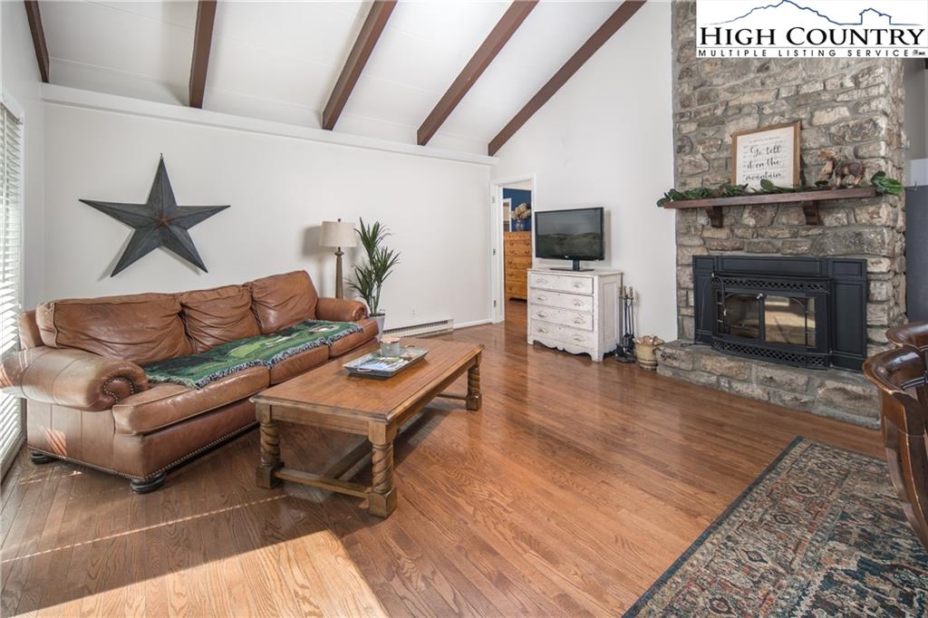 485 Chestnut Drive Boone, NC 28607 - Photo 7 of 48 a living room with furniture and a fireplace