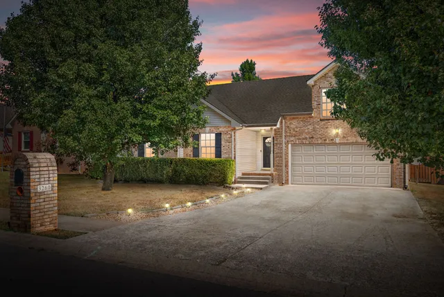 a view of a house with a street