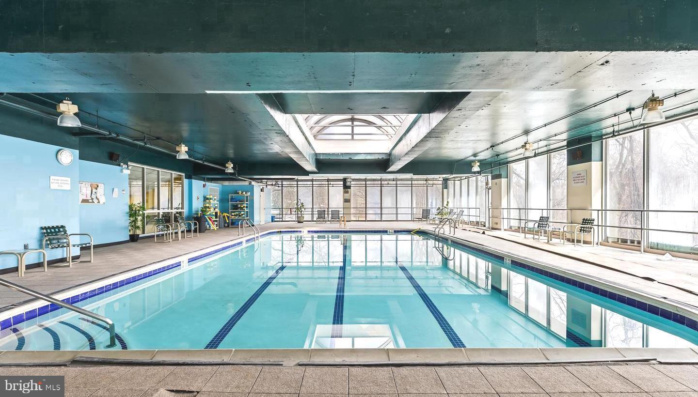 3900-00 West Ford Road, Unit 14K Philadelphia, PA 19131 - Photo 32 of 42 Indoor pool with natural light and tranquility.