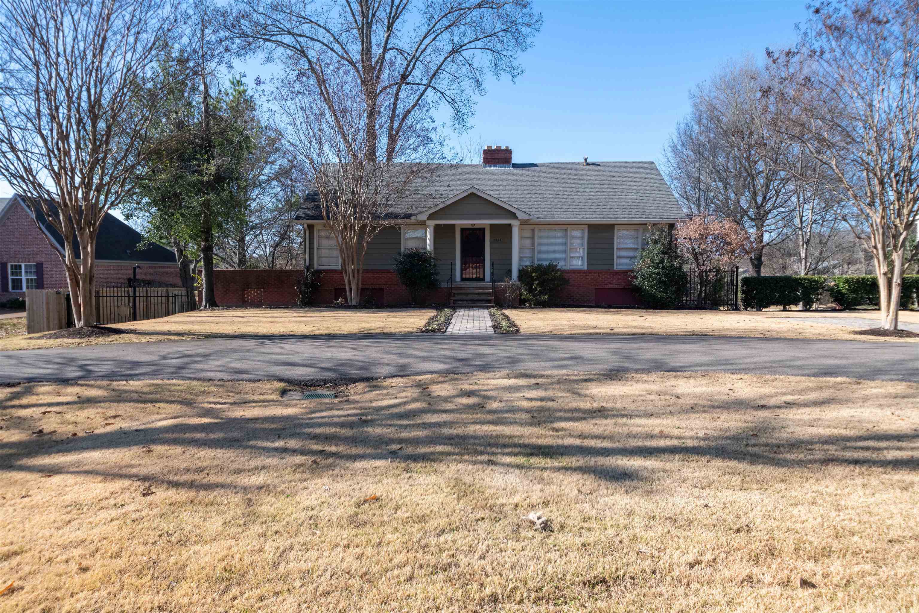 1227 Whitten Road Memphis, TN 38134 - Photo 1 of 15 a front view of a house with a yard