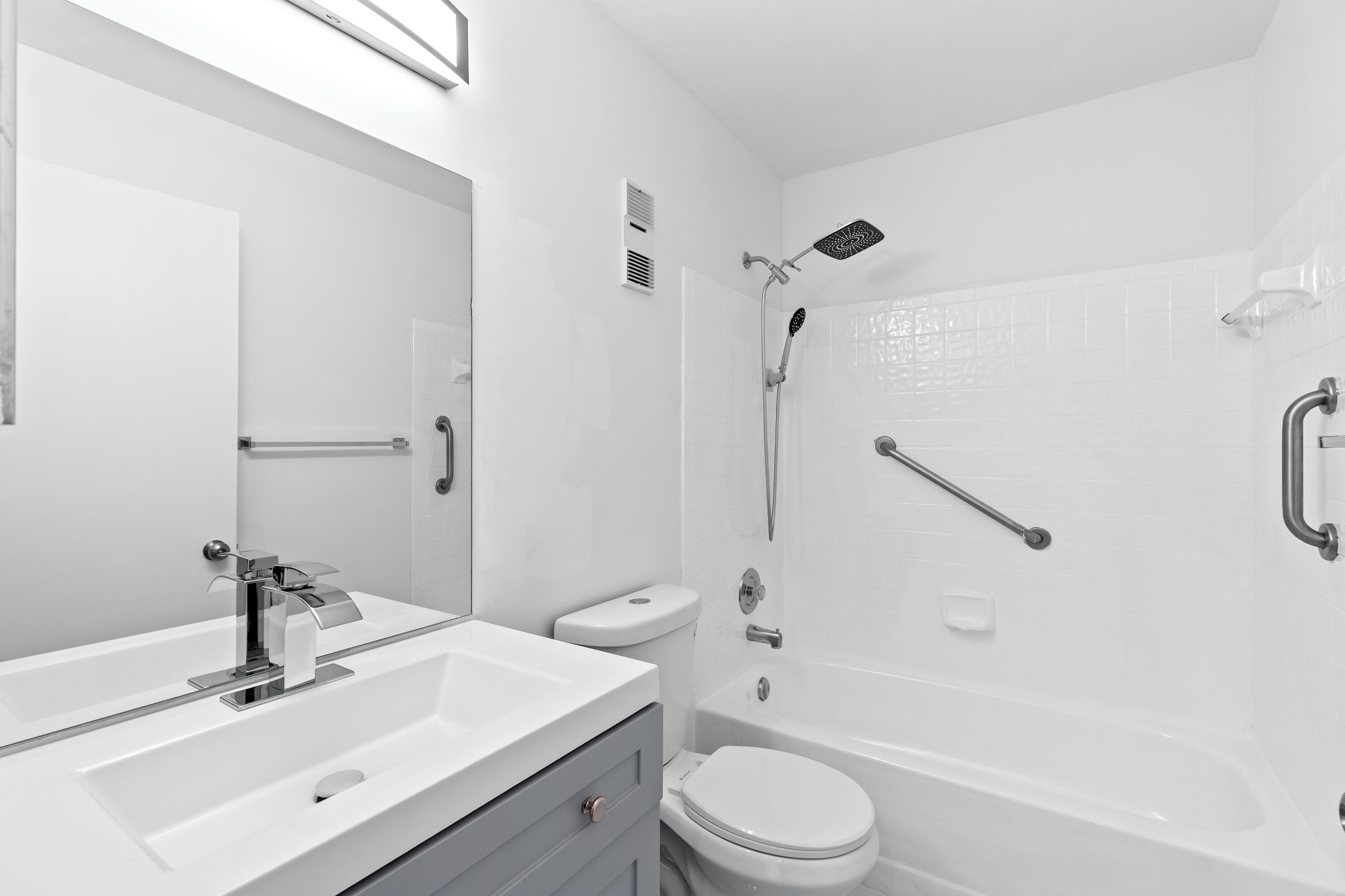 8089 Springtree Road Boca Raton, FL 33496 - Photo 11 of 35 a bathroom with a sink a toilet and a bathtub