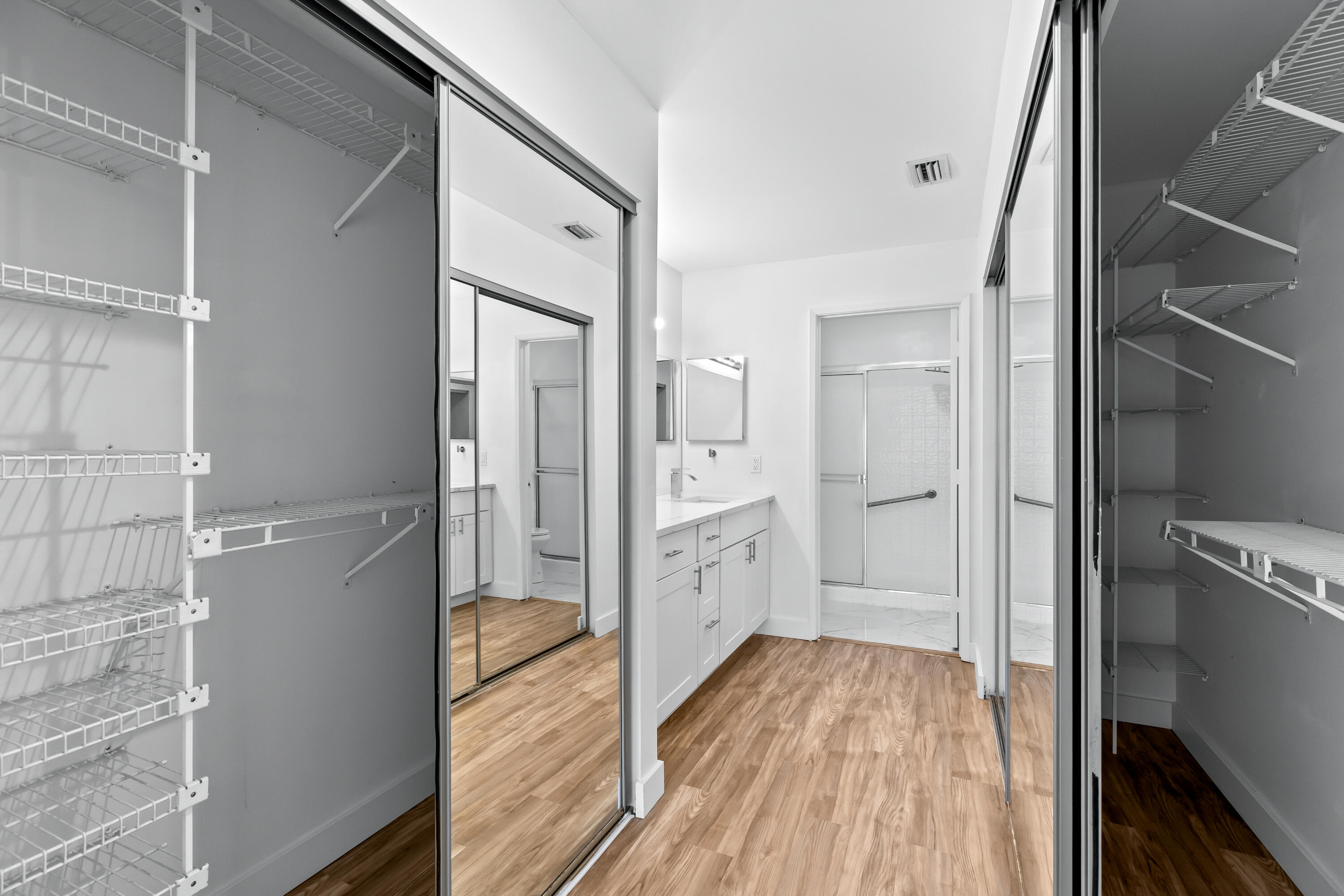 8089 Springtree Road Boca Raton, FL 33496 - Photo 14 of 35 a bathroom with a sink and glass door shower