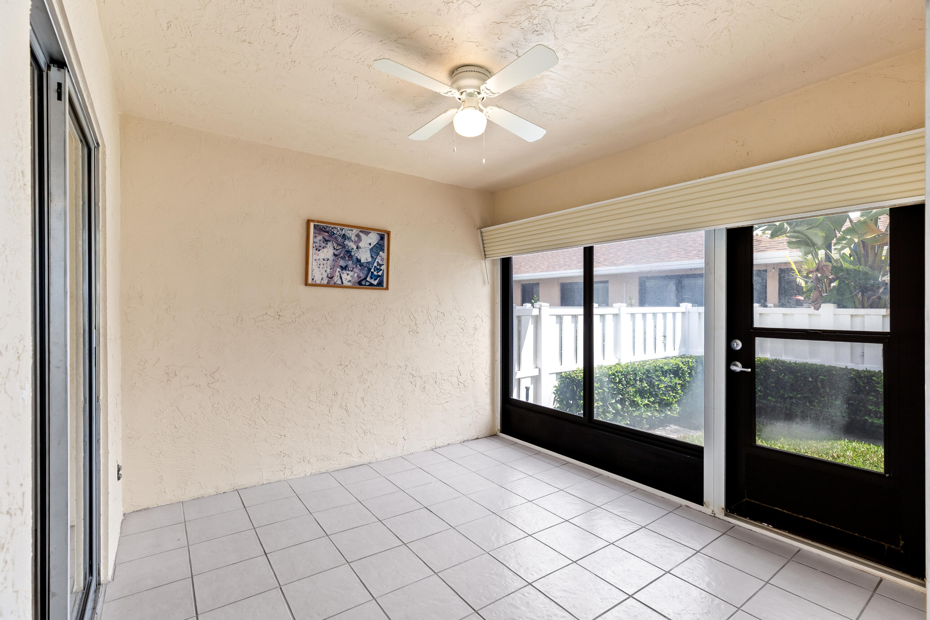 8089 Springtree Road Boca Raton, FL 33496 - Photo 17 of 35 an empty room with windows and closet