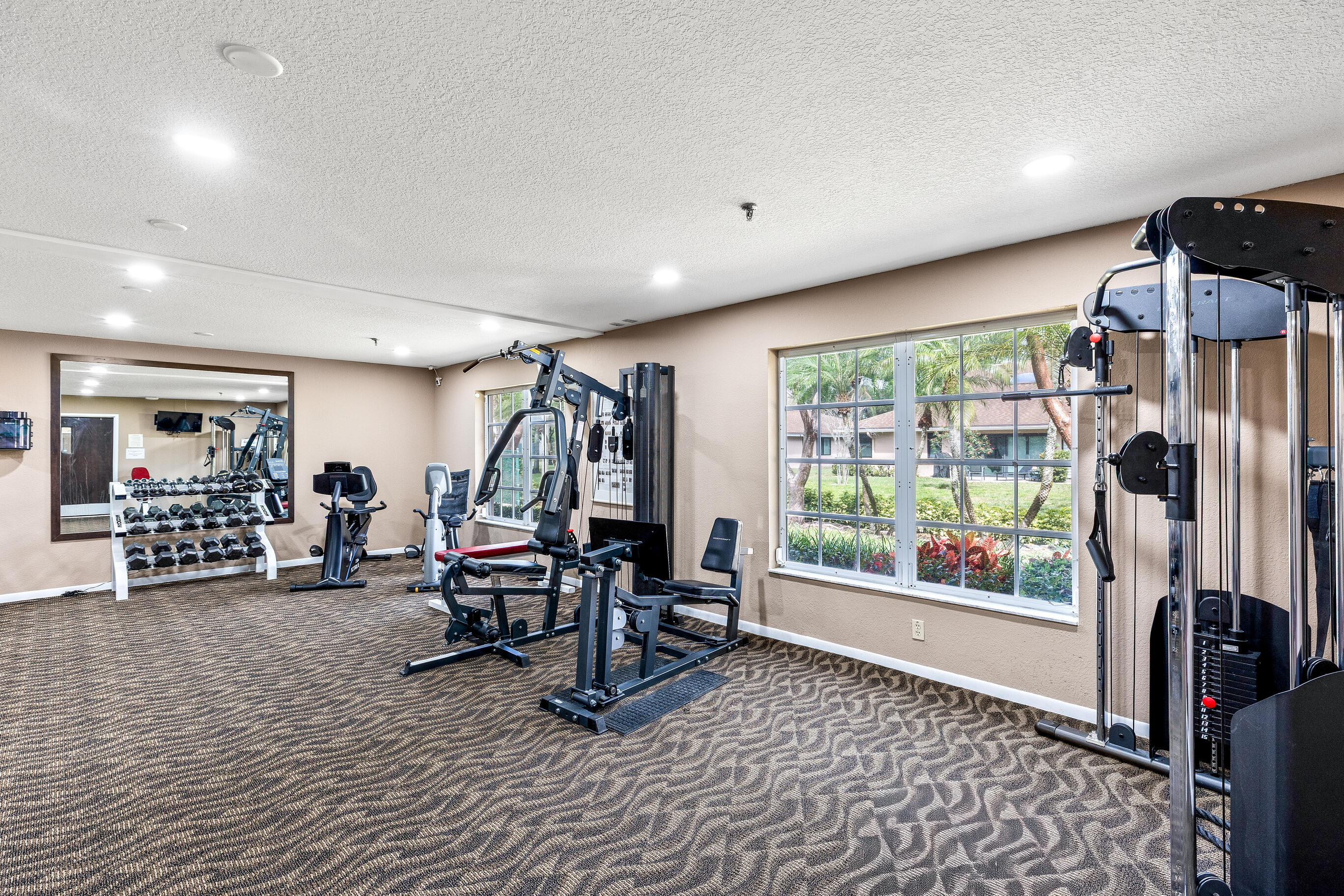 8089 Springtree Road Boca Raton, FL 33496 - Photo 30 of 35 a view of a room with gym equipment