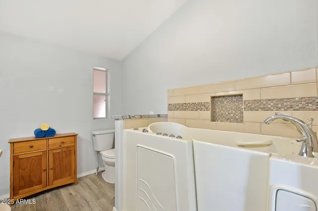 a utility room with a sink washer and dryer