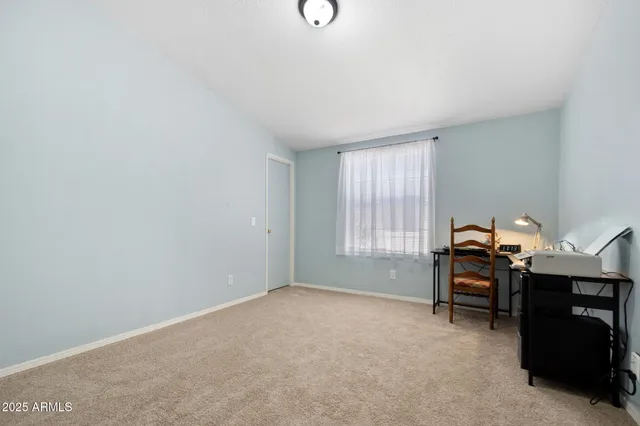 a workspace with furniture and window