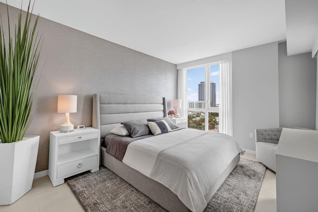 401 North Birch Road, Unit 1103 Fort Lauderdale, FL 33304 - Photo 23 of 45 a bedroom with a large bed and a couch