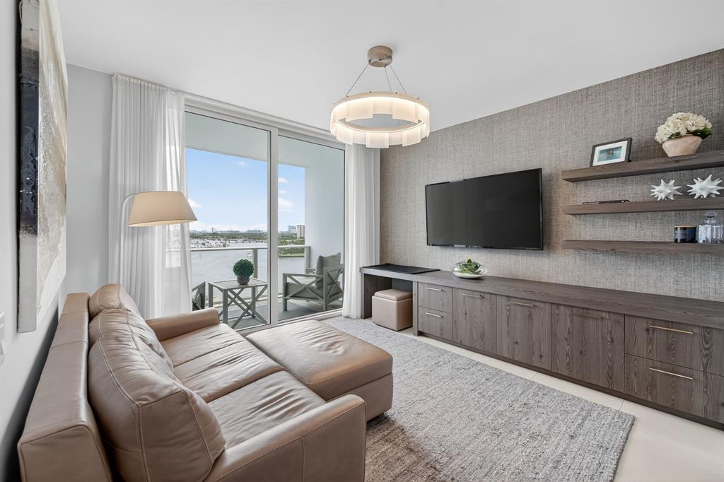 401 North Birch Road, Unit 1103 Fort Lauderdale, FL 33304 - Photo 6 of 45 a living room with furniture and a flat screen tv