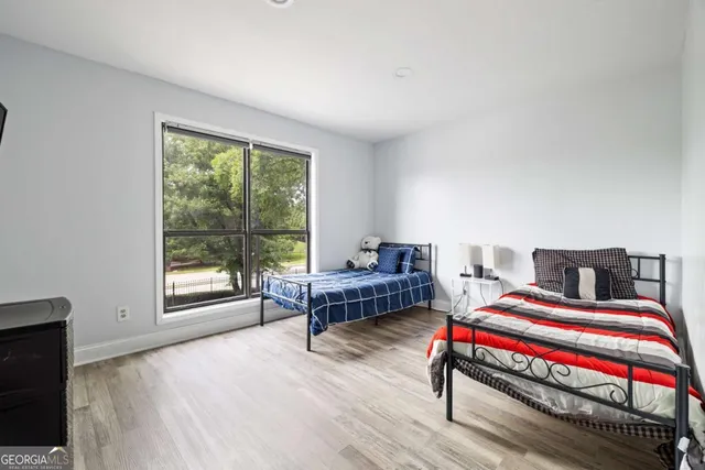 a bedroom with a bed and a window