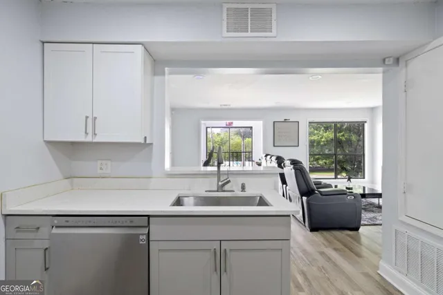 a kitchen with a sink and a window