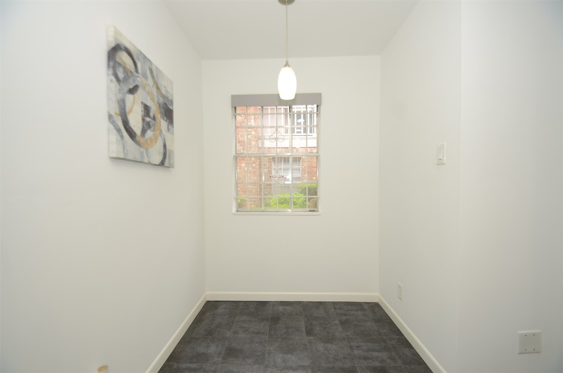 5524 Beverly Hill Street, Unit 2 Houston, TX 77056 - Photo 12 of 43 an empty room with windows