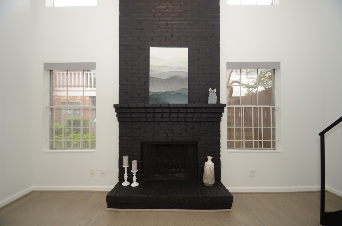 5524 Beverly Hill Street, Unit 2 Houston, TX 77056 - Photo 15 of 43 a living room with furniture and a fireplace
