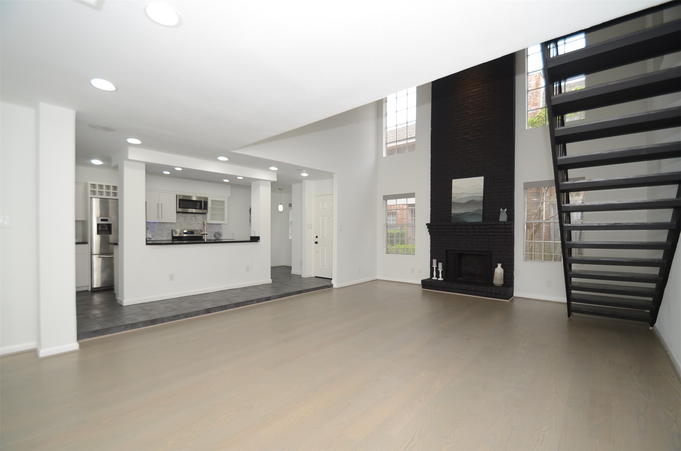 5524 Beverly Hill Street, Unit 2 Houston, TX 77056 - Photo 43 of 43 a view of an empty room with kitchen and a window