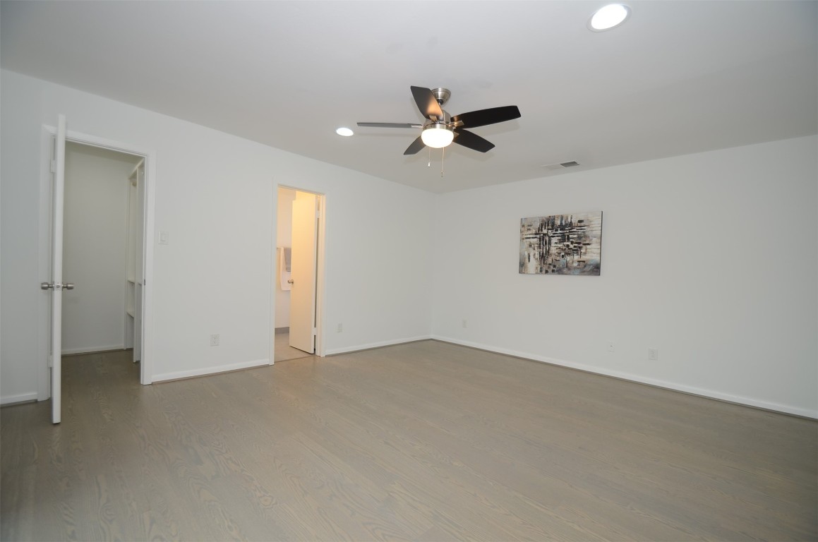 5524 Beverly Hill Street, Unit 2 Houston, TX 77056 - Photo 21 of 43 wooden floor in an empty room