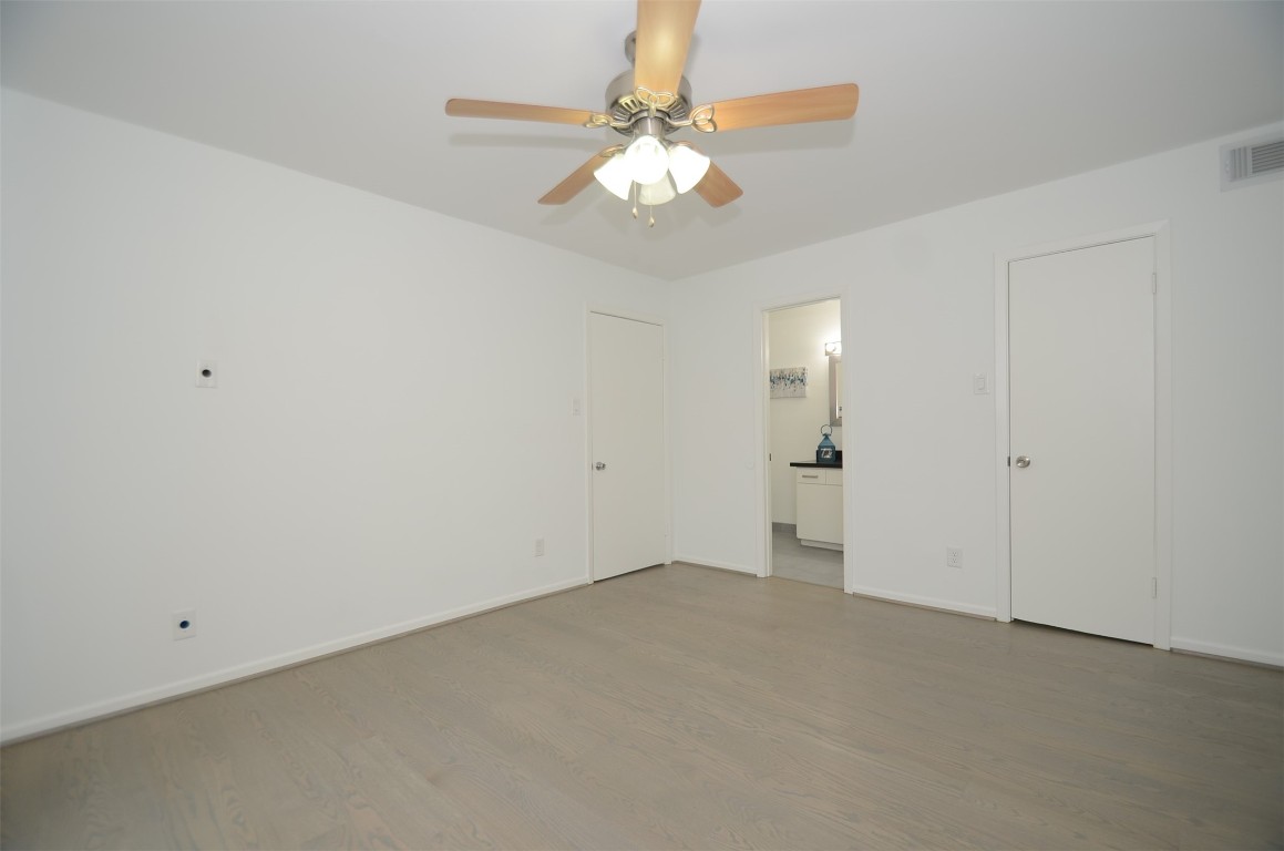 5524 Beverly Hill Street, Unit 2 Houston, TX 77056 - Photo 28 of 43 a view of an empty room with a chandelier fan