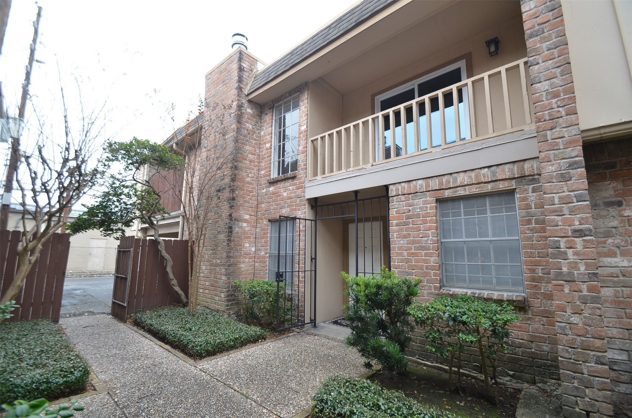 5524 Beverly Hill Street, Unit 2 Houston, TX 77056 - Photo 2 of 43 a front view of a house with garden