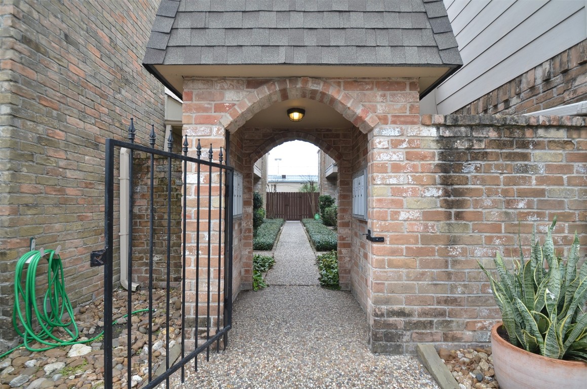 5524 Beverly Hill Street, Unit 2 Houston, TX 77056 - Photo 41 of 43 a front view of a house with a garden