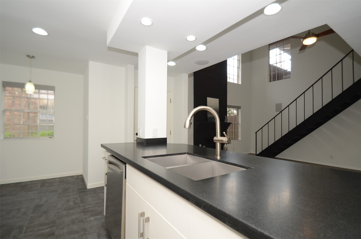 5524 Beverly Hill Street, Unit 2 Houston, TX 77056 - Photo 7 of 43 a kitchen with counter top a sink and dishwasher