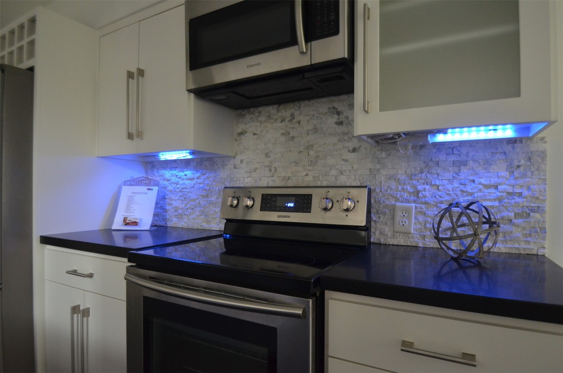 5524 Beverly Hill Street, Unit 2 Houston, TX 77056 - Photo 8 of 43 a stove top oven sitting inside of a kitchen