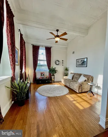 a kitchen with stainless steel appliances granite countertop a refrigerator a sink a stove and cabinets