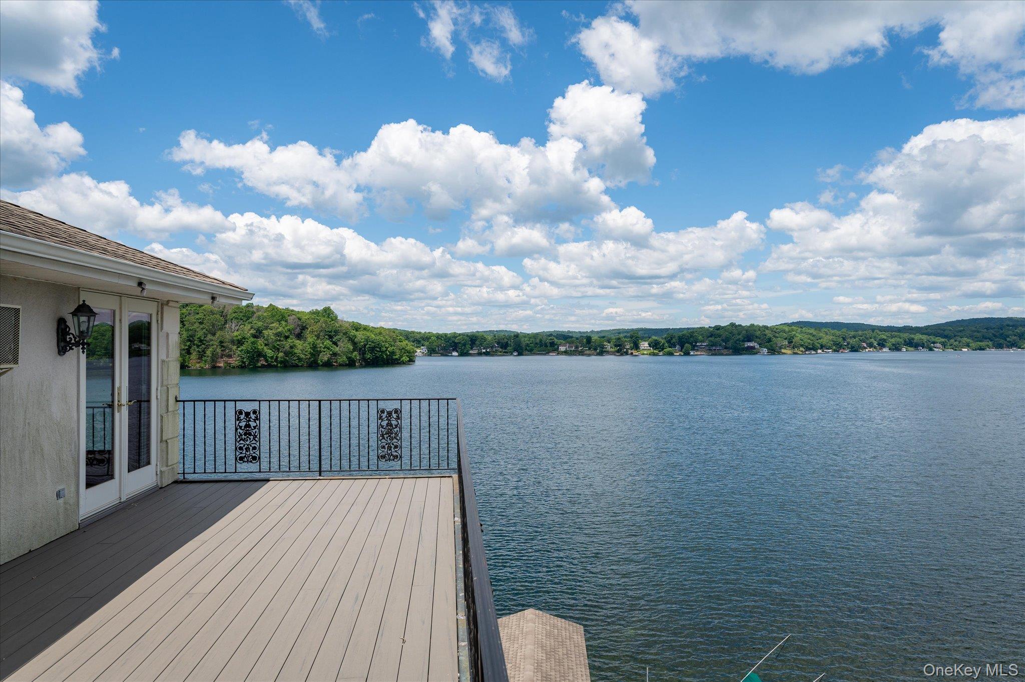 41 Tamarack Road Mahopac, NY 10541 - Photo 34 of 41 A private deck suspended above Lake Mahopac, where the views stretch as far as the eye can see